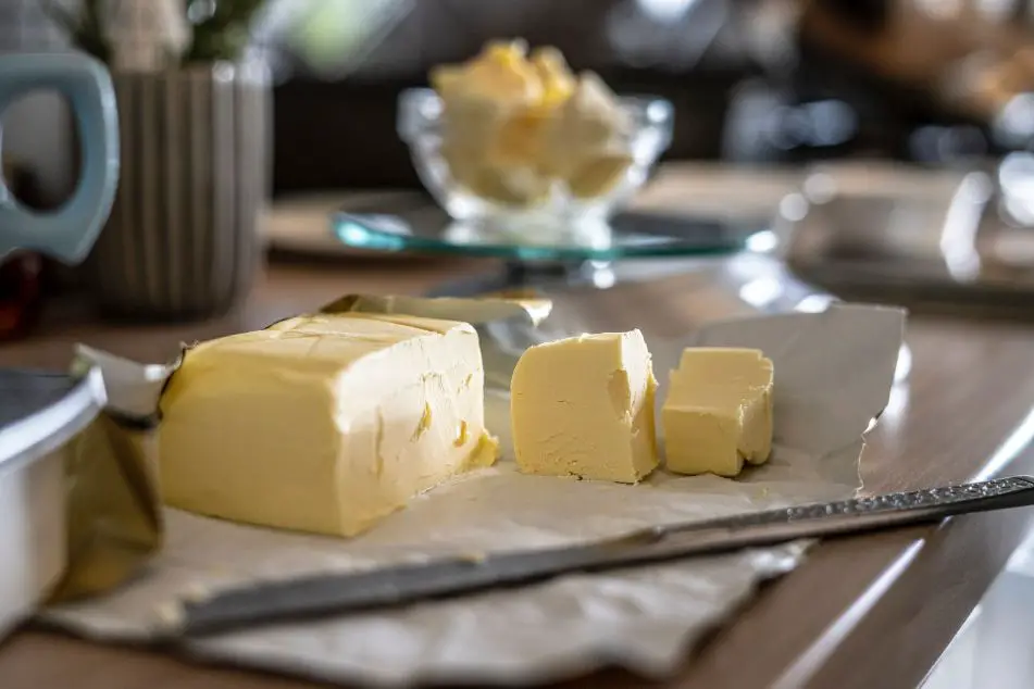 Butter chunk with a kitchen knife
