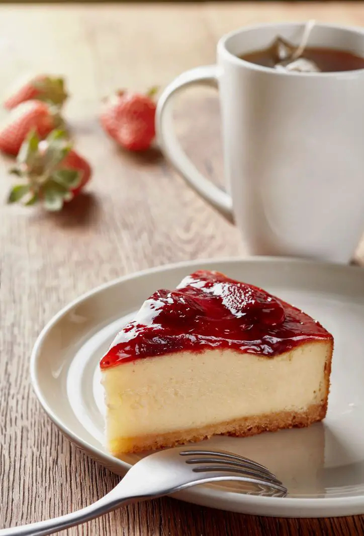 A slice of cheesecake on a plate - what causes cheesecake to crack