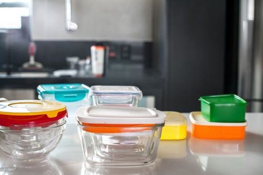 colorful plastic boxes on top of kitchen counter