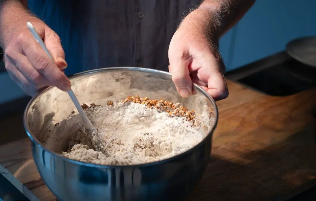 Dough preparation for a bread mixing ingredients in a bowl
